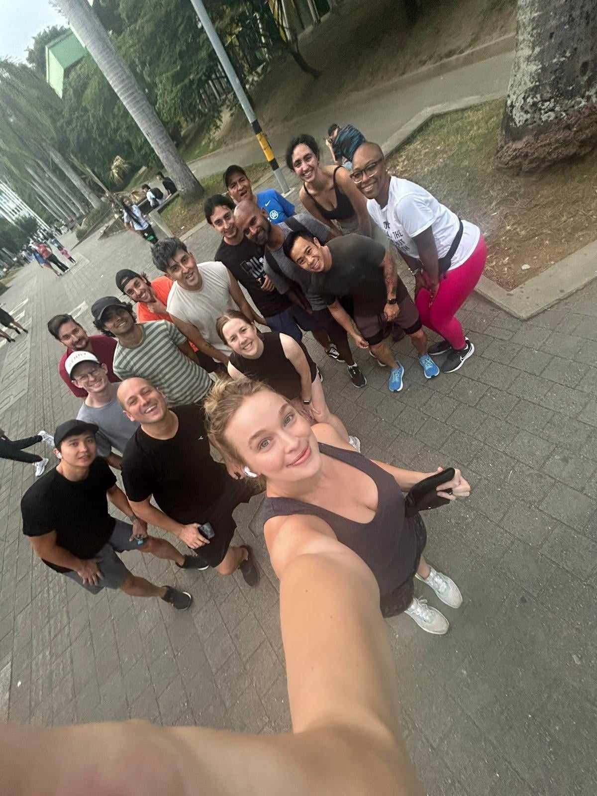 Large group of Balu community members posing for a selfie during a run club outing