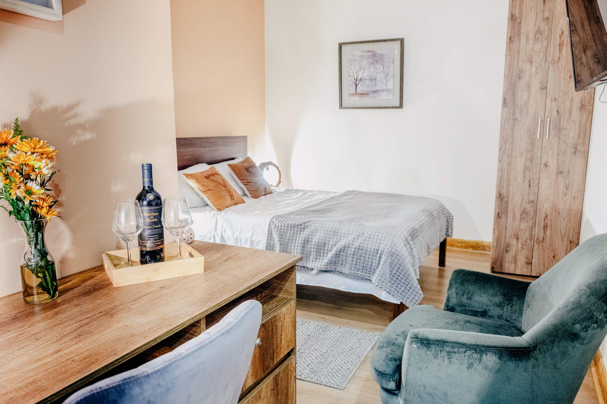 Main view of Bedroom 7 with a double bed and the largest work desk in Balu