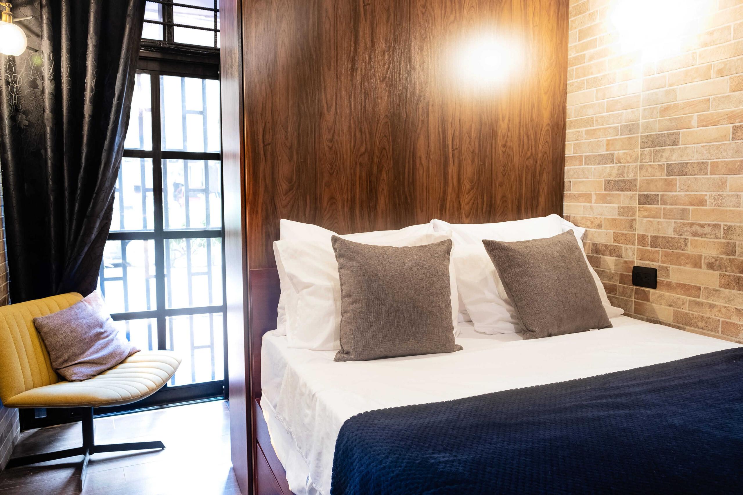 Main view of the modern, cosy studio with a double bed, private kitchen, and 58" Samsung Smart TV