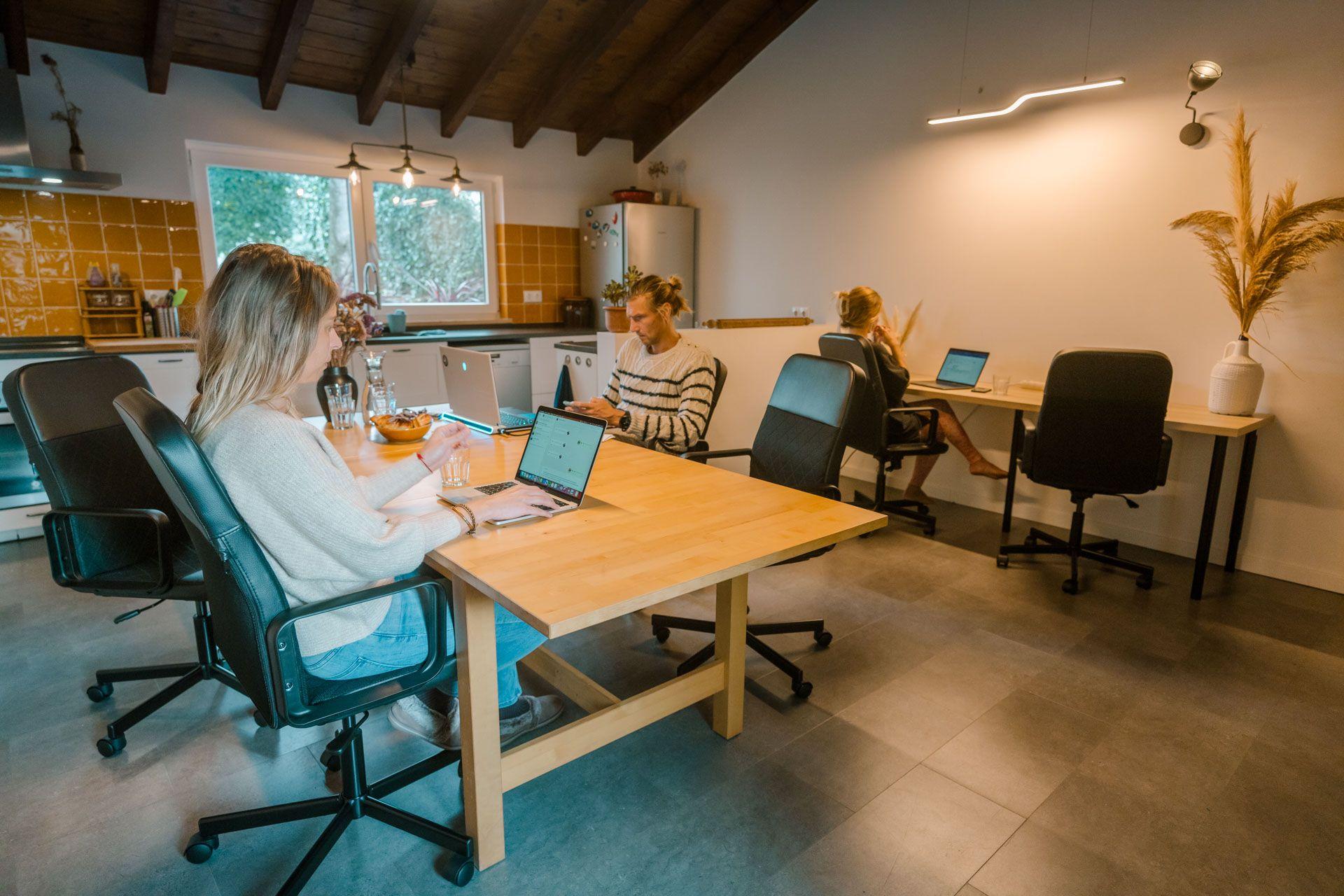 The communal coworking area with desks