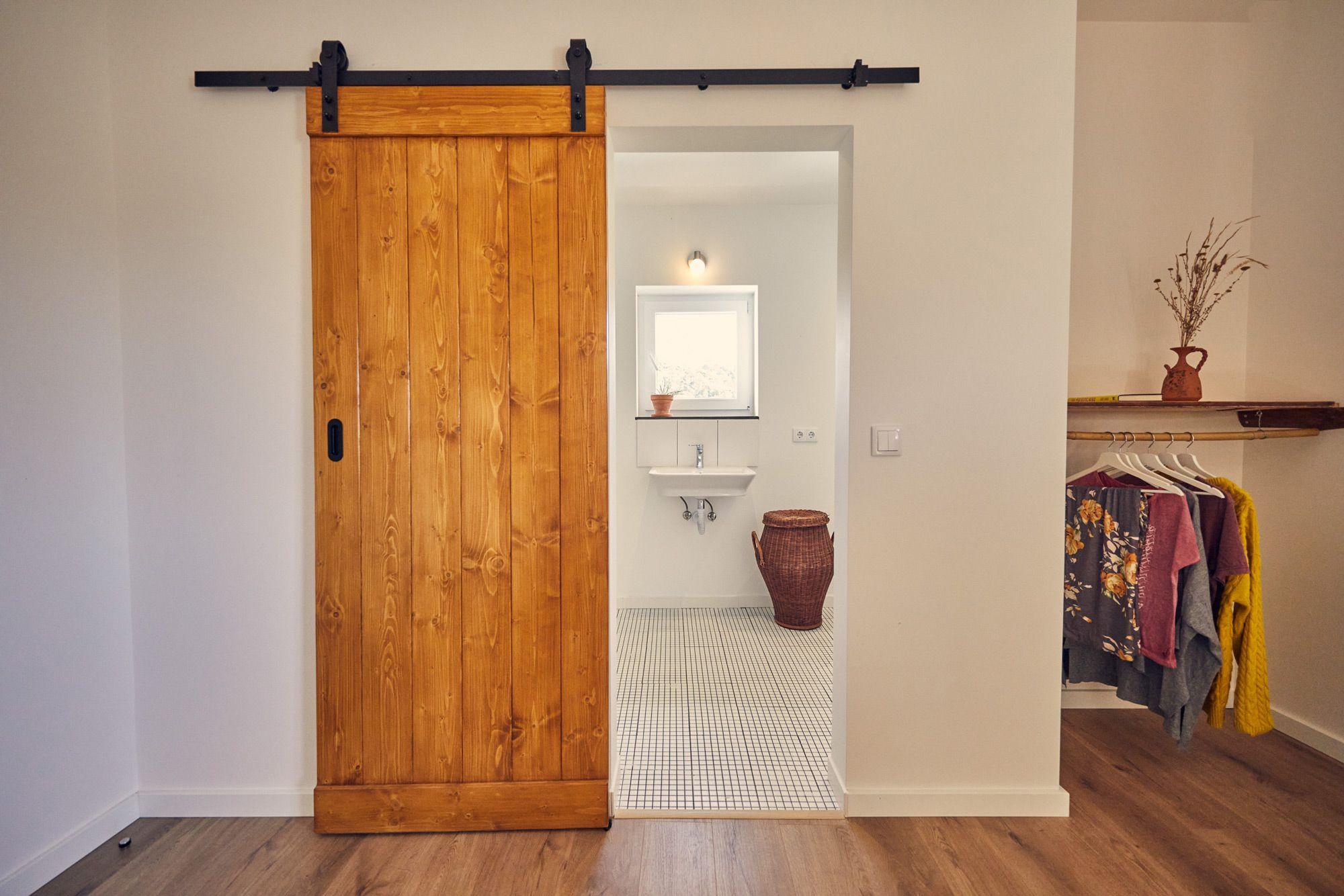 View from the kingsize bed in The Painting of the Valley room showing bathroom and open closet