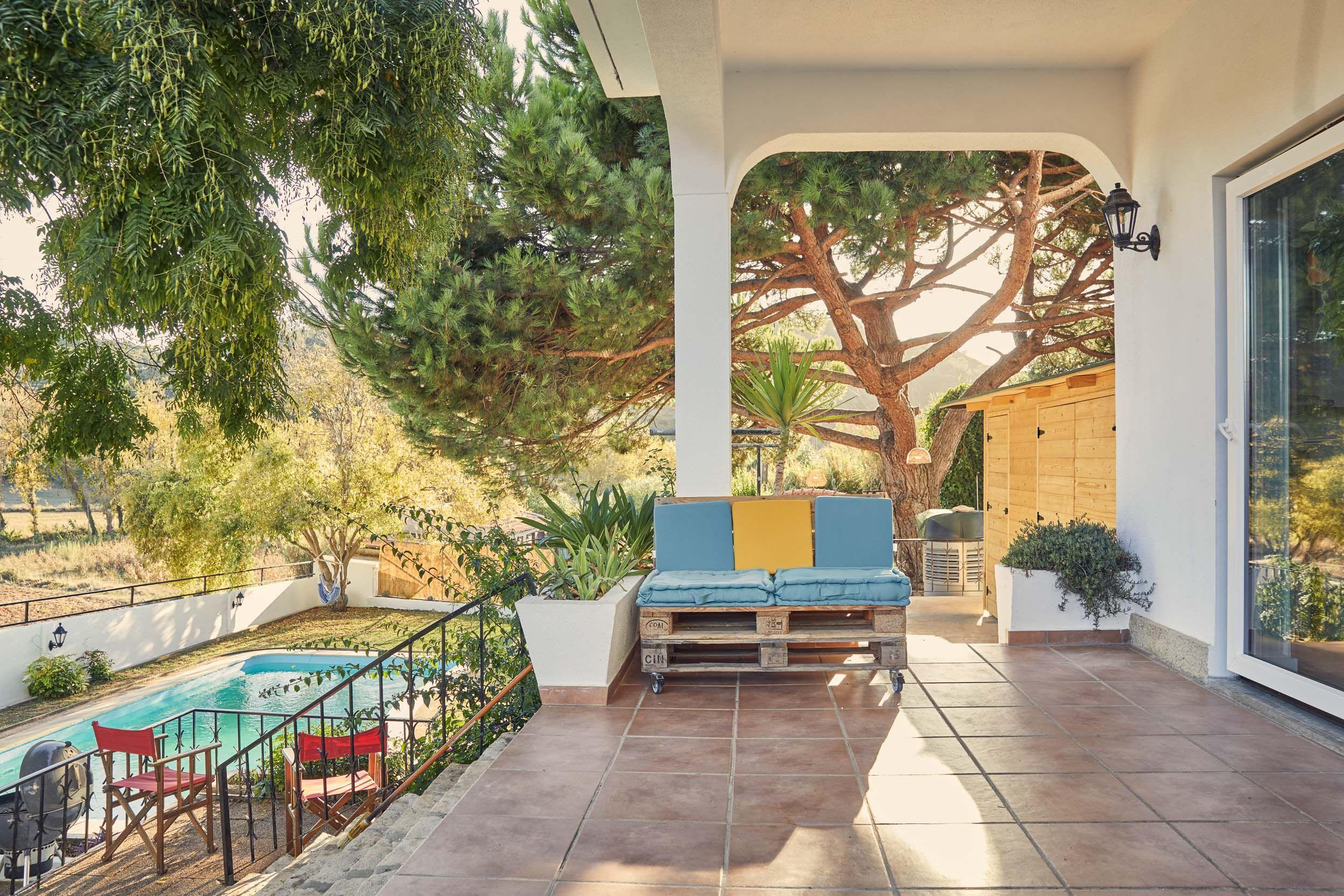 The spacious living room lounge area with sofa overlooking the valley