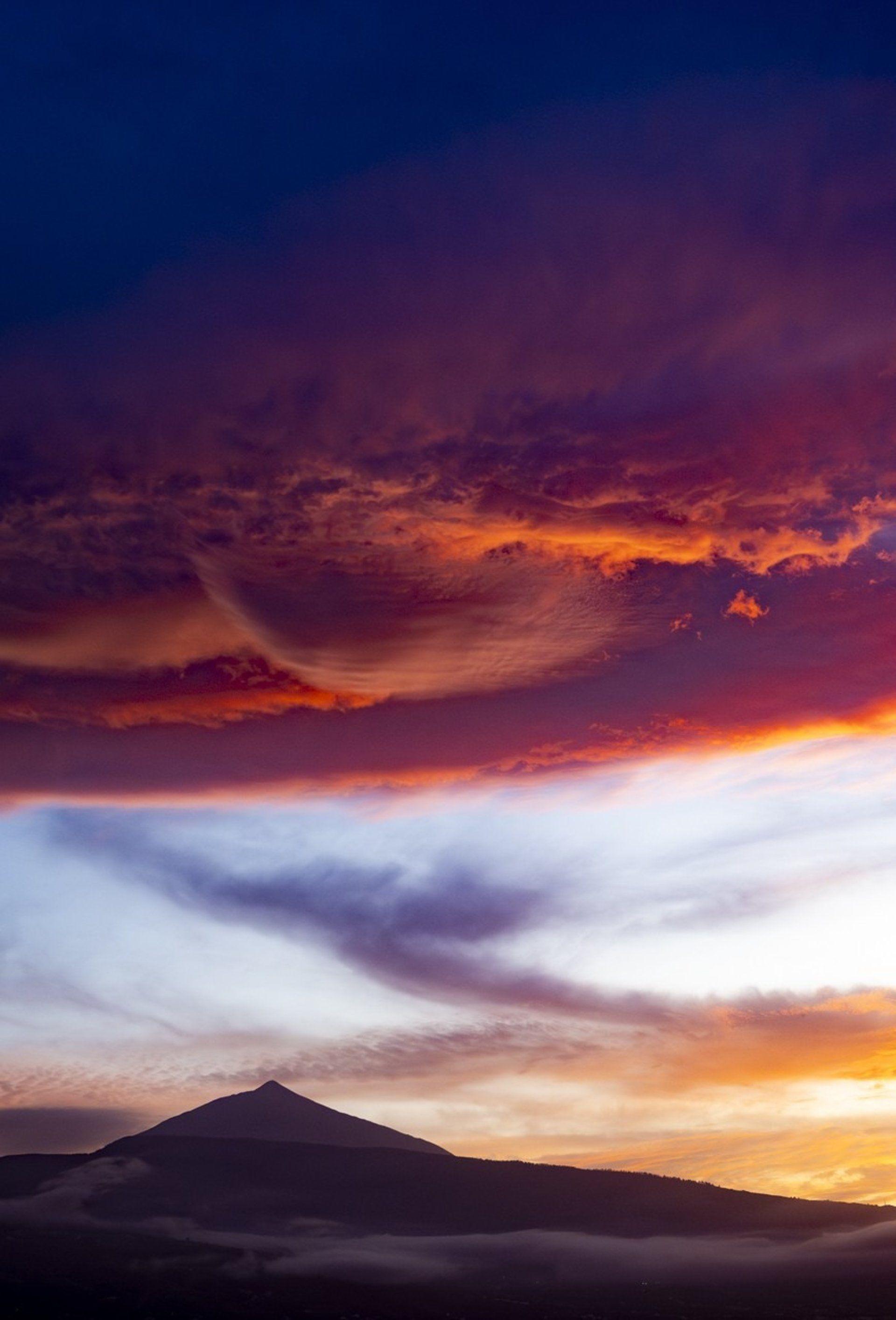 Dramatic sunset sky over Mount Teide volcano silhouette