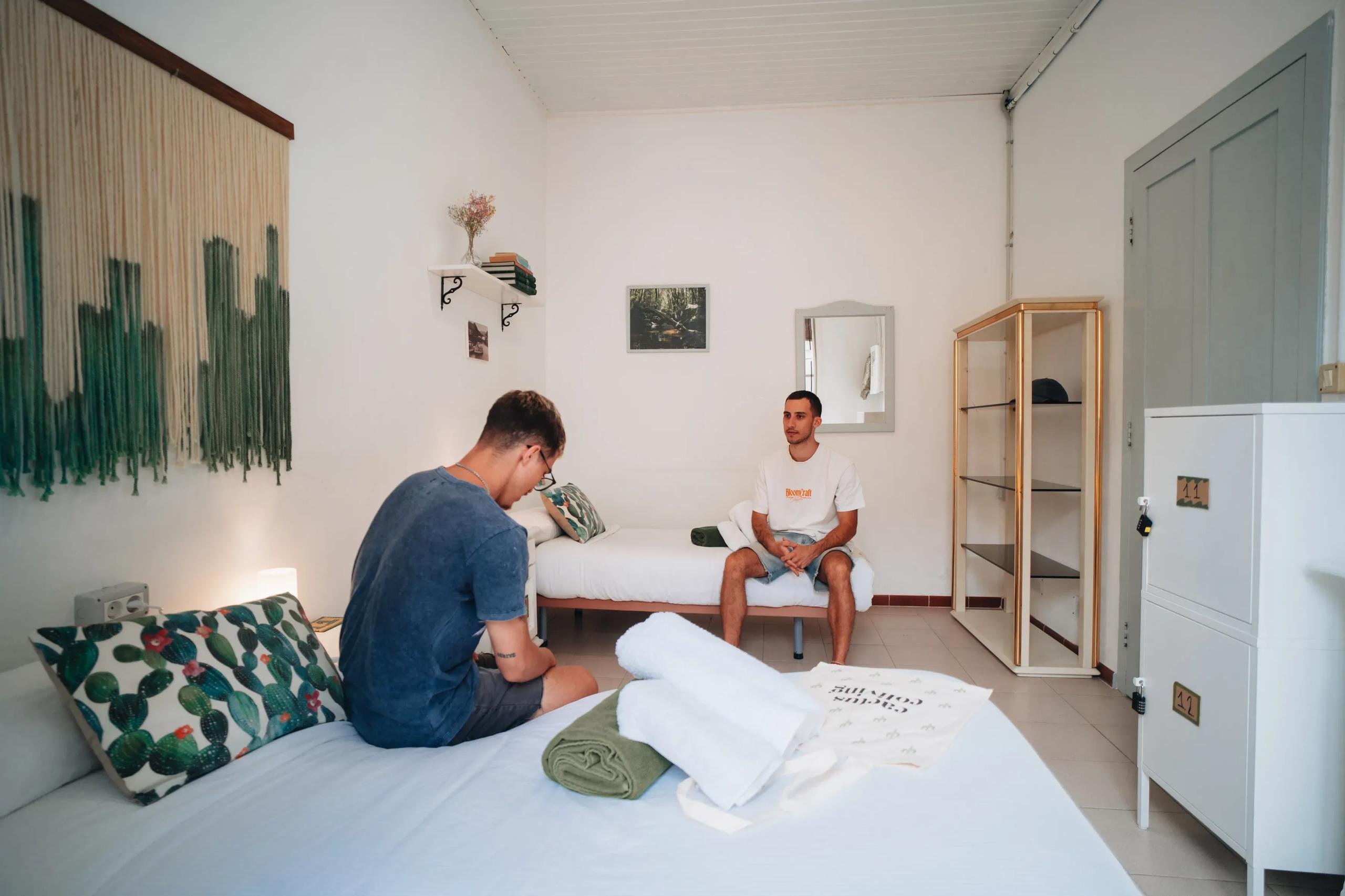 Boys shared room with two beds and macramé wall art at Cactus La Gomera