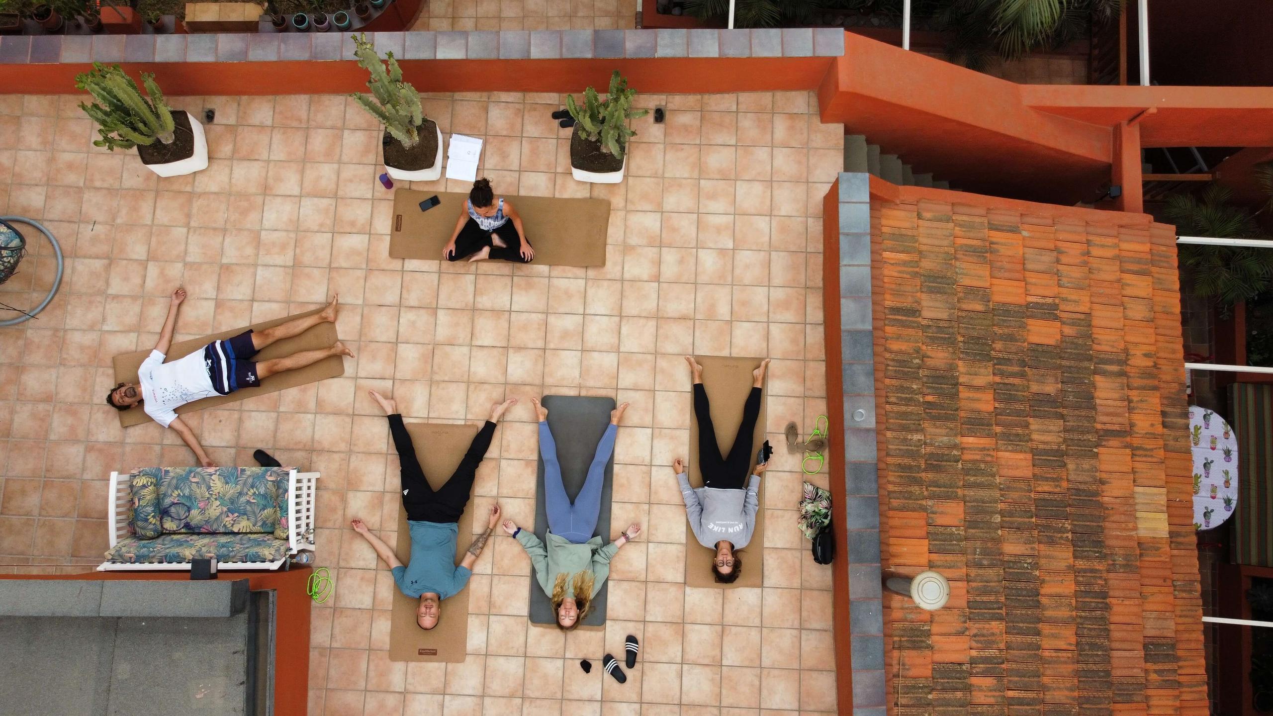 People at Cactus Coliving doing yoga.
