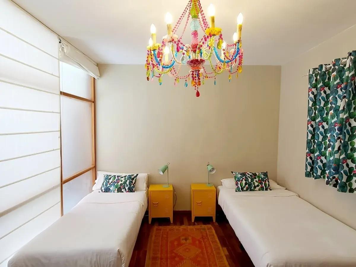 2 Comfortable single beds in the female only shared room at Cactus Coliving Tenerife.