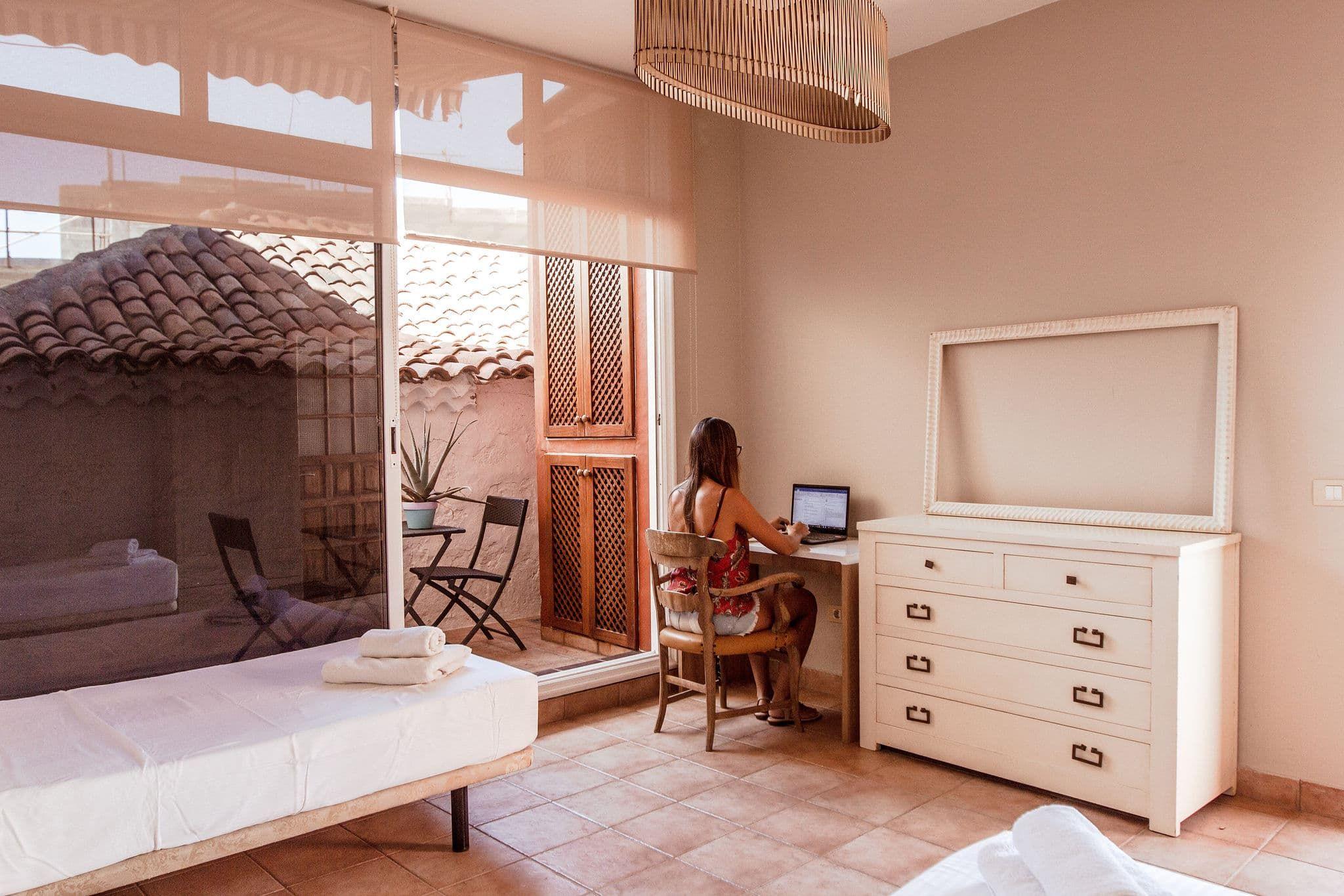 A digital nomad working remote from the twin shared room at Cactus Coliving Tenerife.