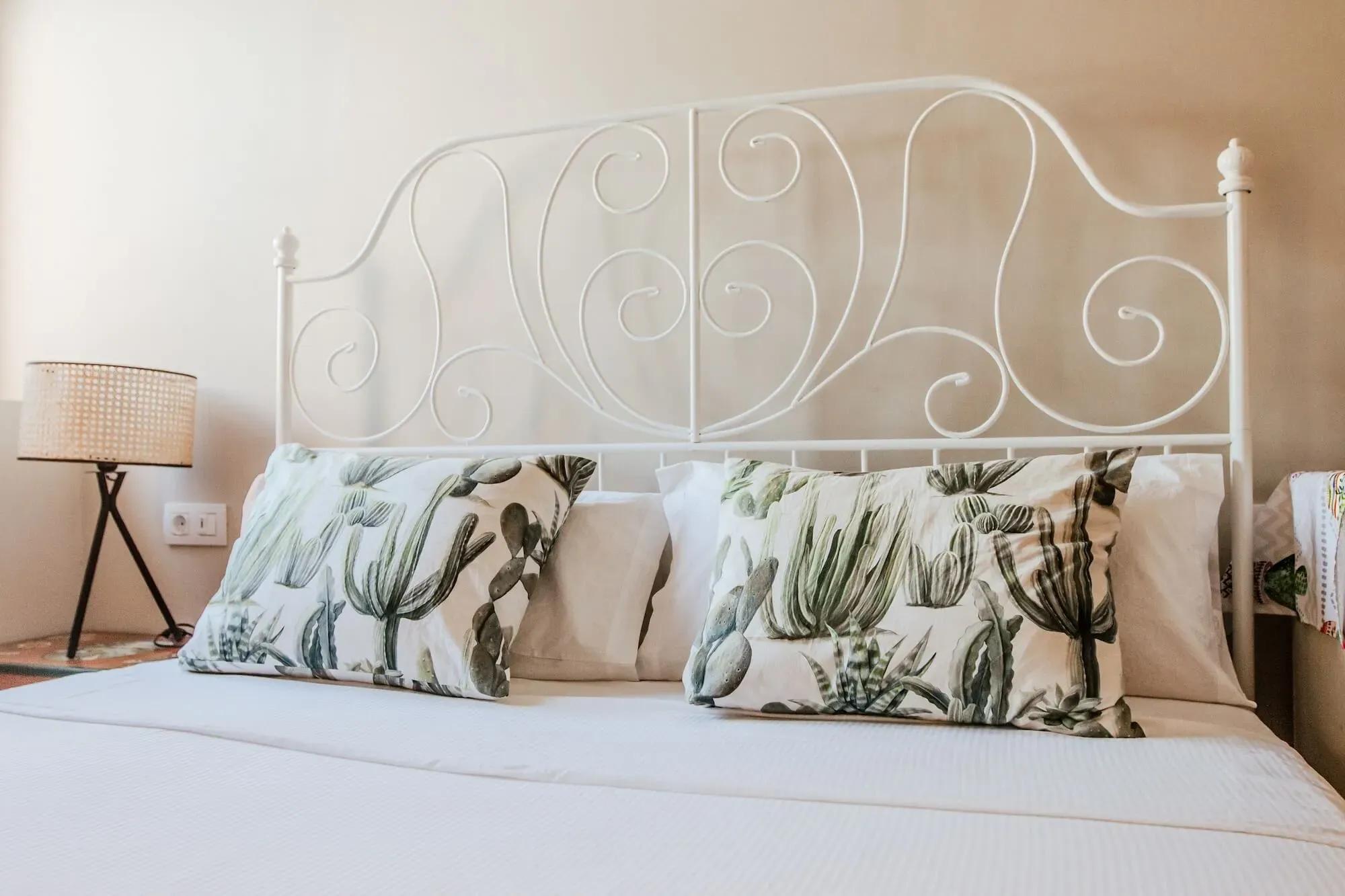 A comfortable bed in one of the cozy rooms at Cactus Coliving.