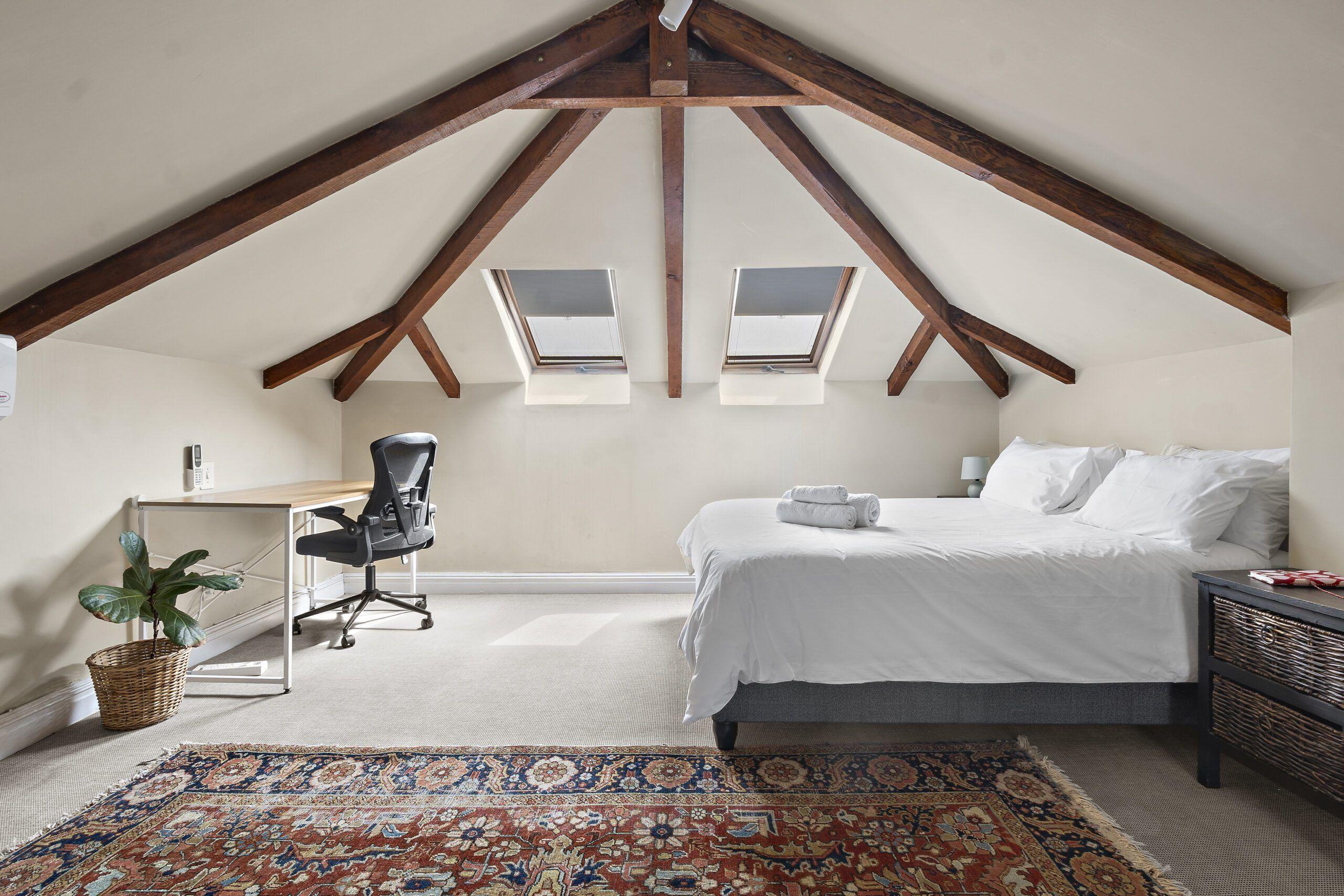 King-sized bed in the Loft Superior Suite with lofted sleeping area