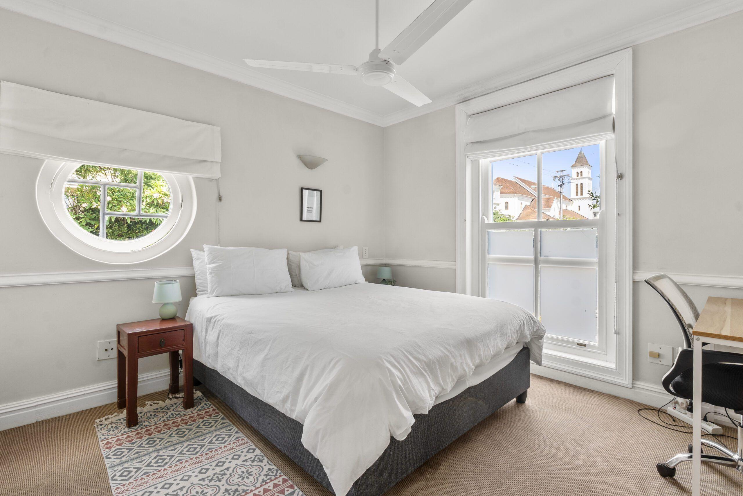 Queen-sized bed in the Ship Queen Suite