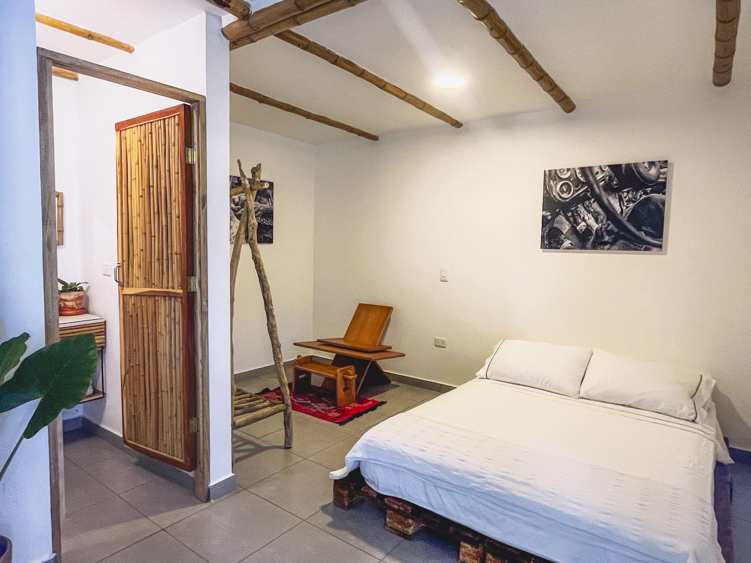 Los Monos room — cozy double-bed room for guests seeking a private, comfortable space to recharge