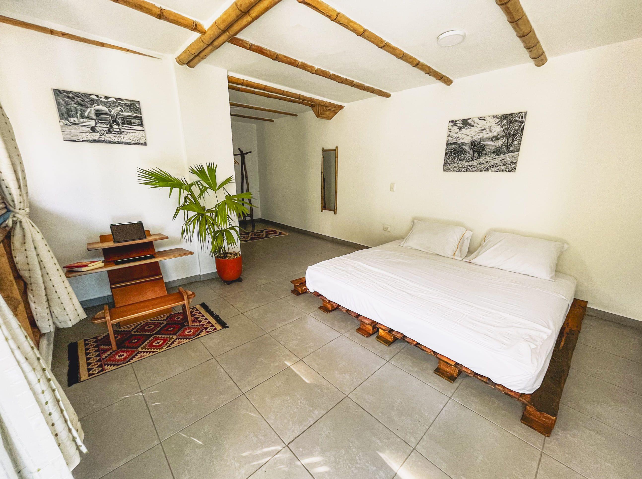 San Luis room — largest room with king-size bed and two desks, perfect for couples or long-term guests