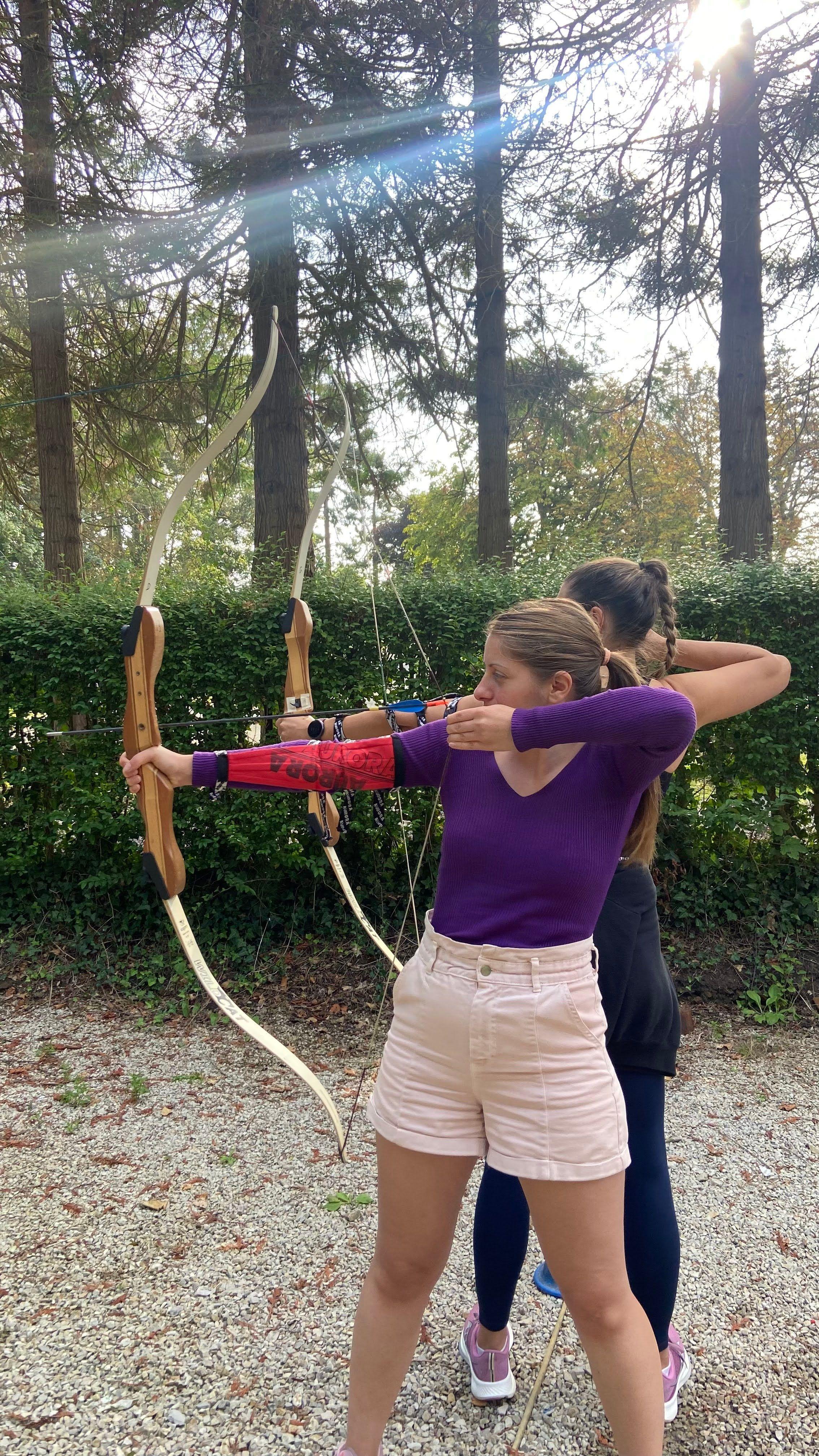Coliver practicing archery in the grounds of Château Coliving