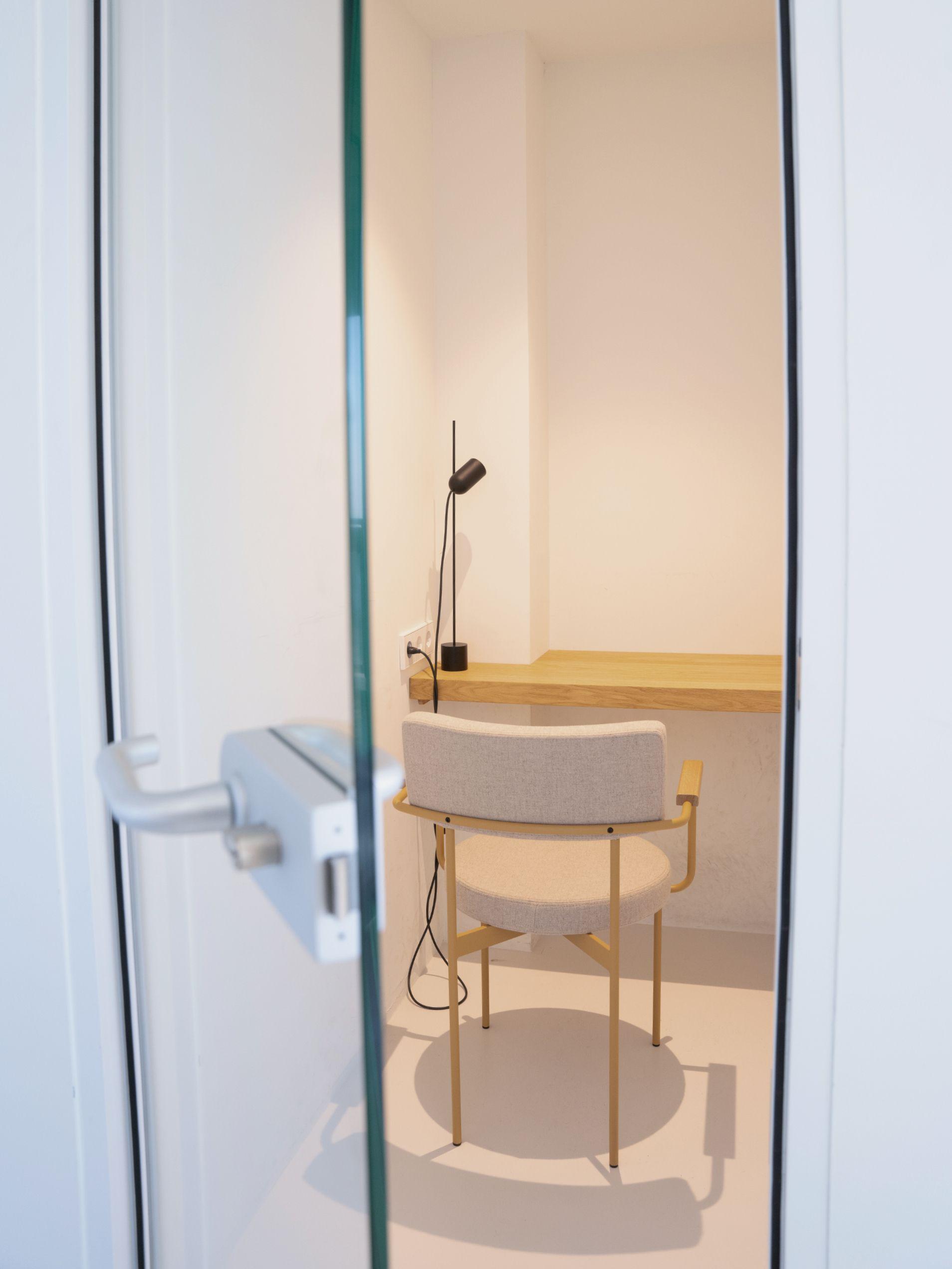 Close-up of gym equipment including a treadmill and stationary bike in the fitness room.