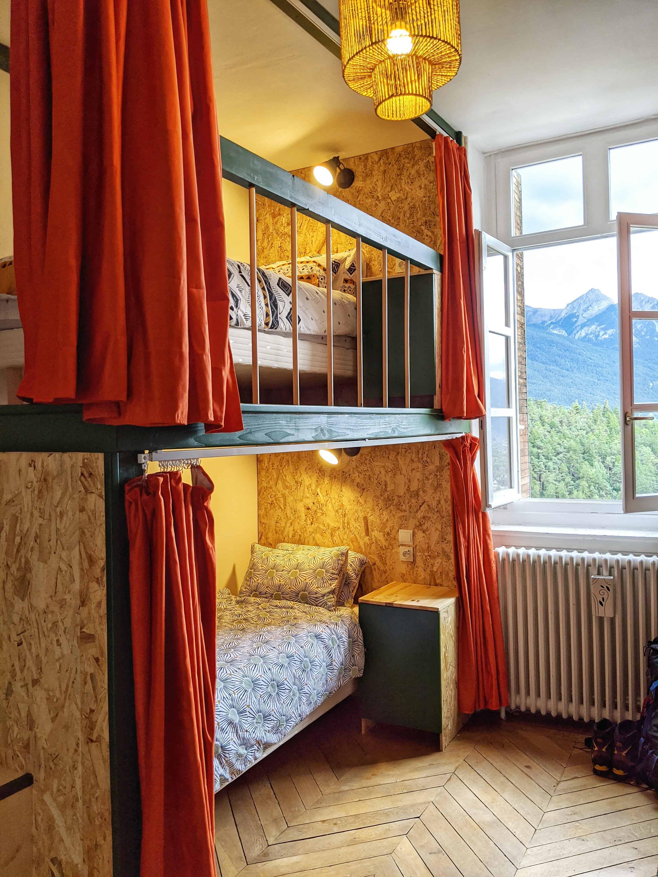 Custom-built mezzanines creating four sleeping pods with privacy curtains