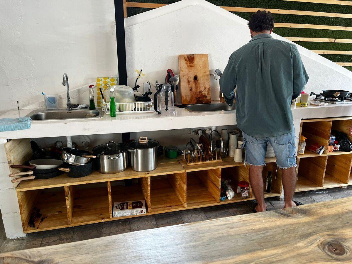 Kitchen with dining table and cooking facilities