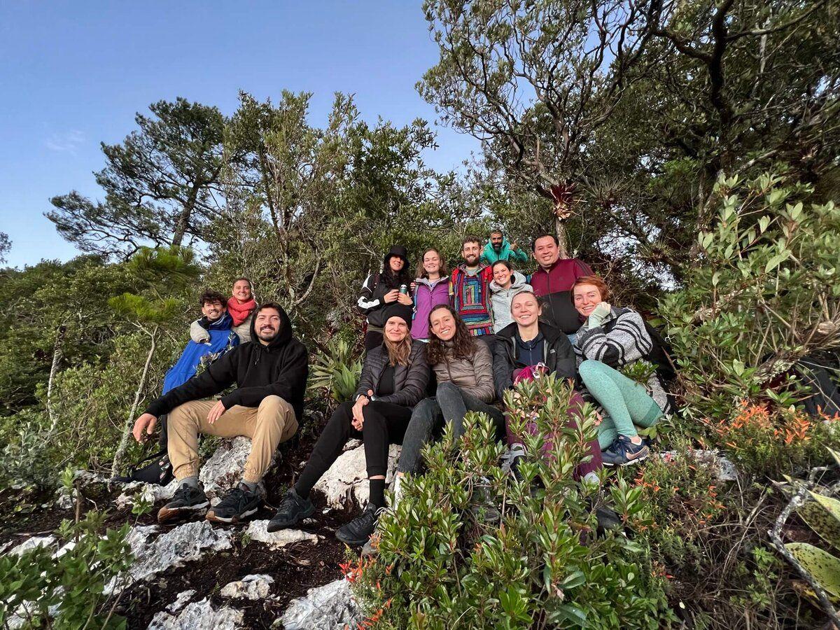 Group of Co404 community members on a hike in the mountains near San Cristóbal