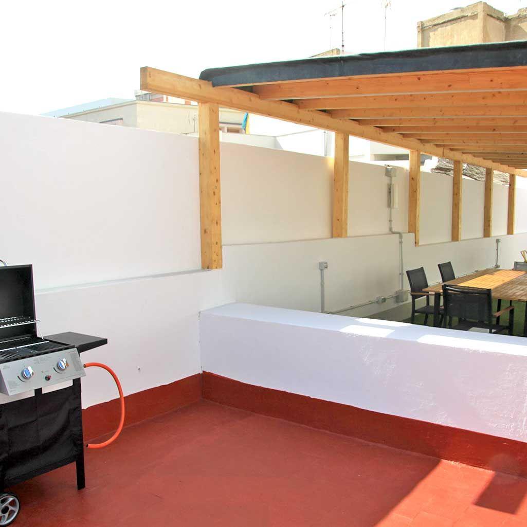 Barbecue area on the rooftop terrace at Coliving 1907
