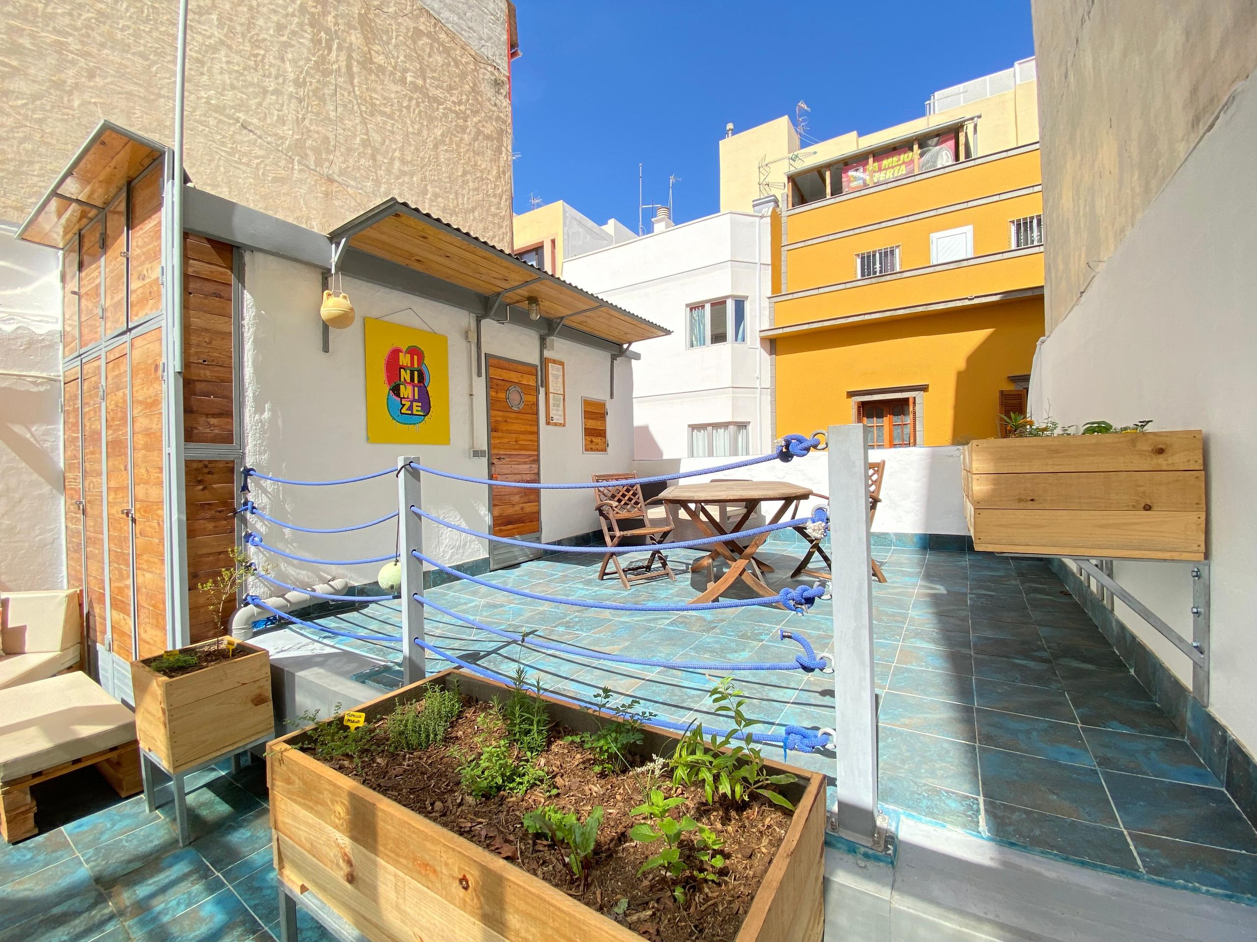 EcoIsleta Sustainable Coliving, sunny terrace for Remote Workers. Chill Out and Local plants on the terrace