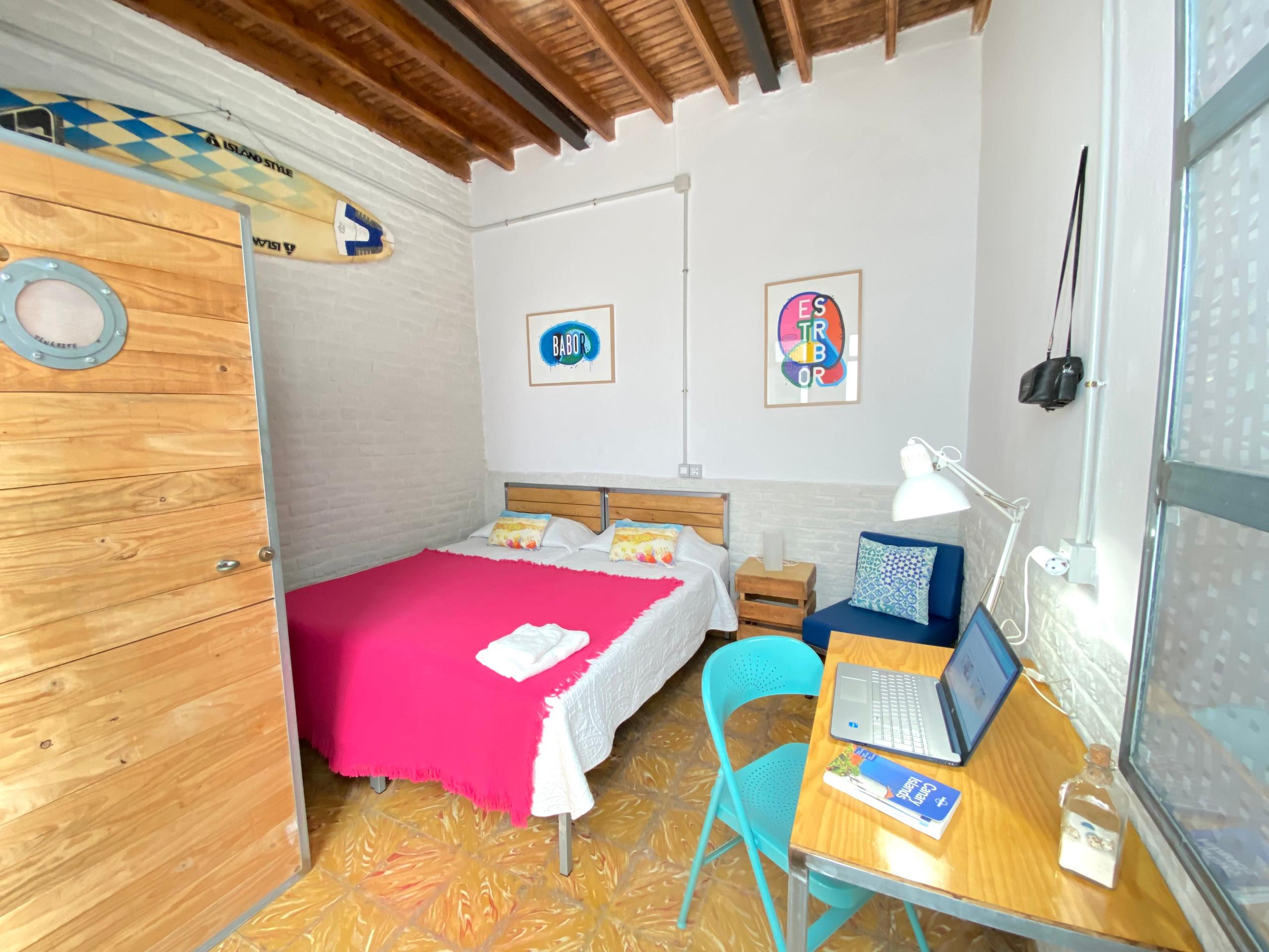 Beautiful double room, with two comfy beds and a desk to work remotely inside of the room.