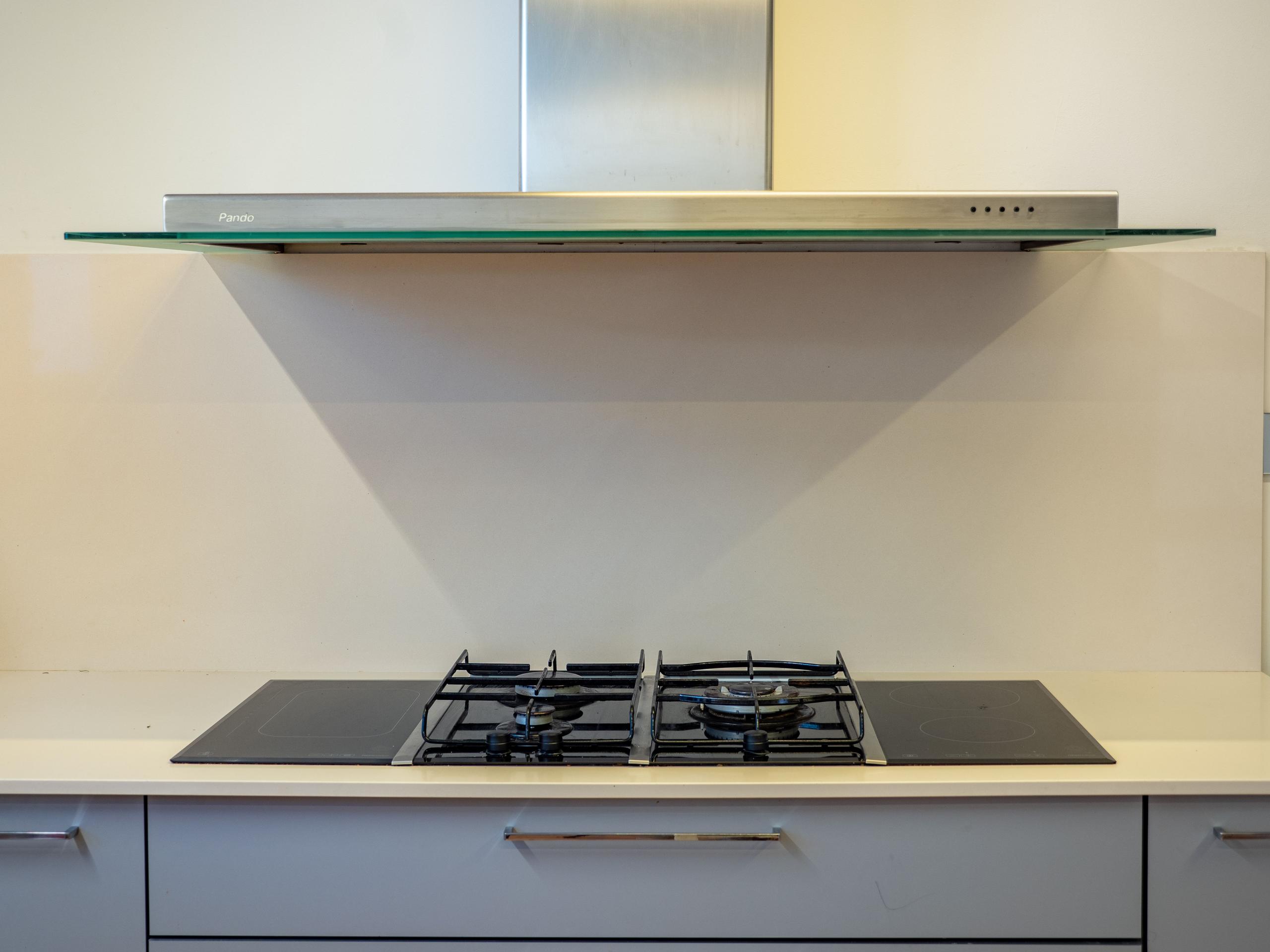 Close-up of the kitchen gas hob and extractor hood