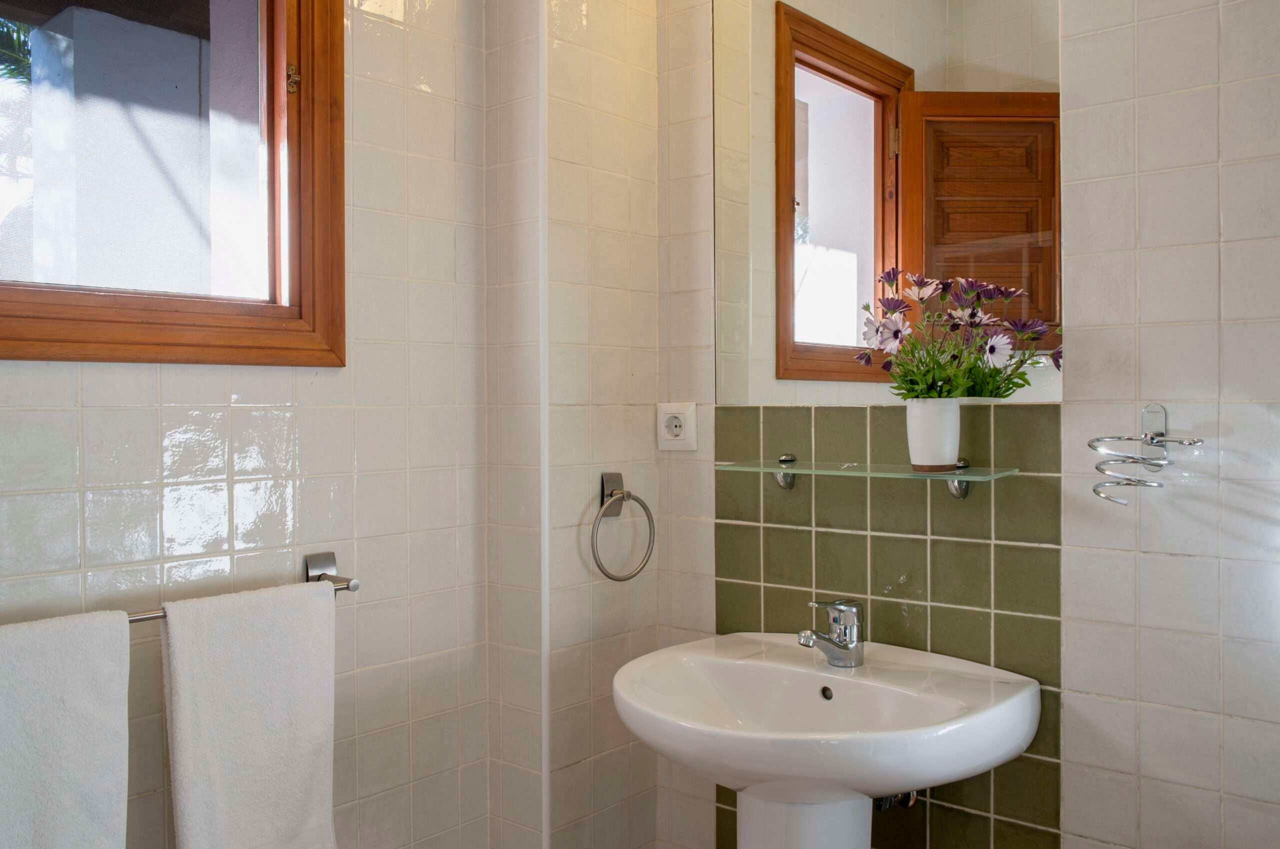 bathroom with green tiles