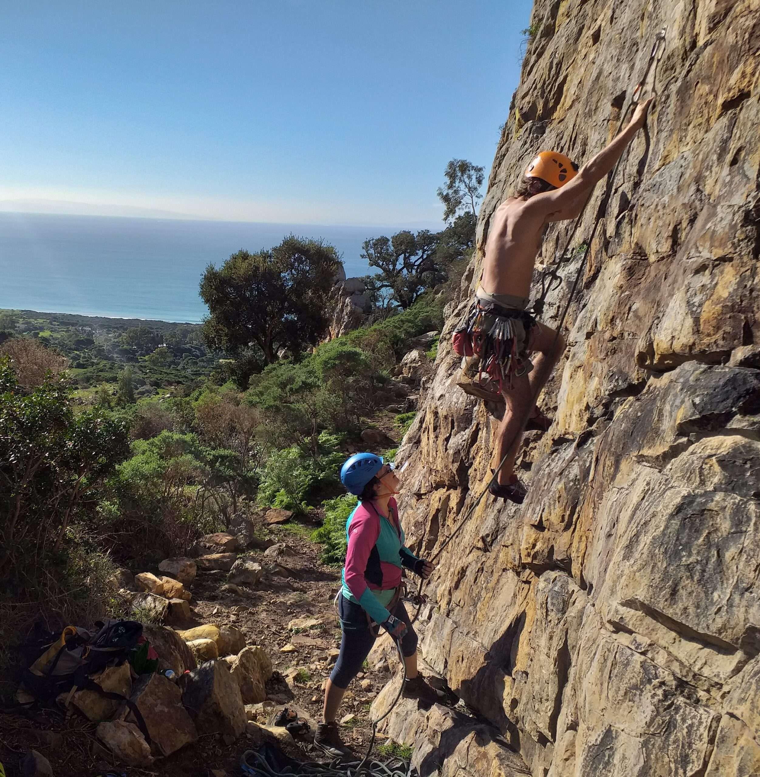 2 people rock climbing