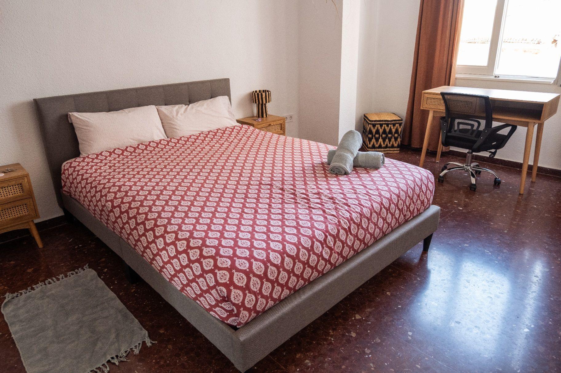 Our most spacious 20m² private room with a queen bed, 2 desks, AC/heating, and a large dressing area