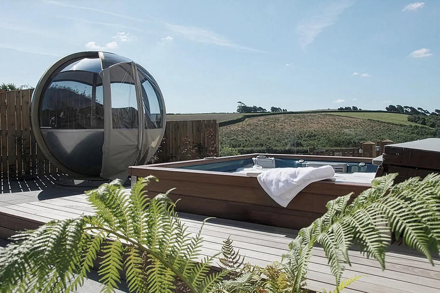 Outdoor tropical spa area with massaging hot tub