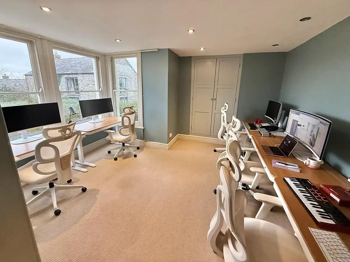 Co-working space with 34" monitors for focused creative work