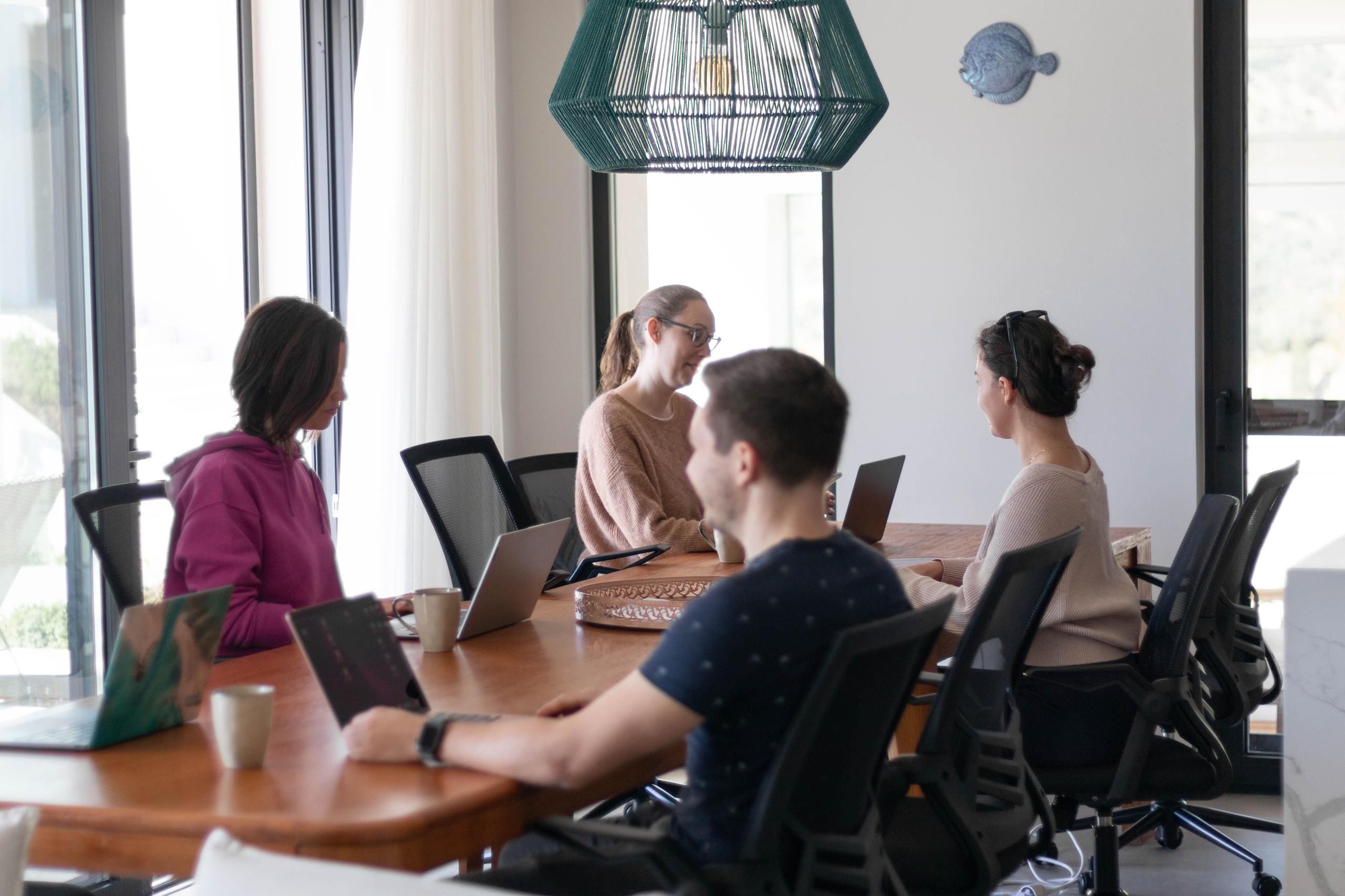 Open-plan coworking area with large table and seating