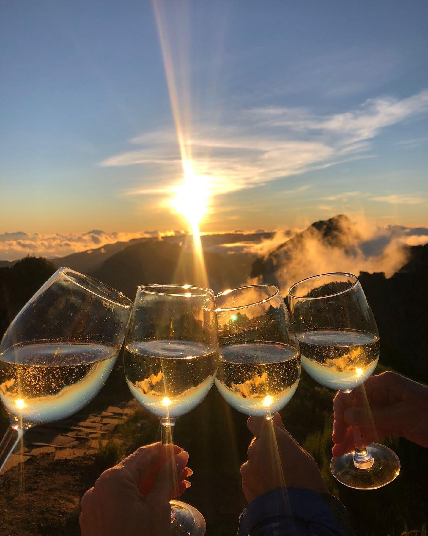 Raising a glass of bubbly, this group of friends from Homeoffice Madeira celebrates the awe-inspiring sunset from Pico do Arieiro, one of Madeira's highest peaks, and creating lifelong memories together.