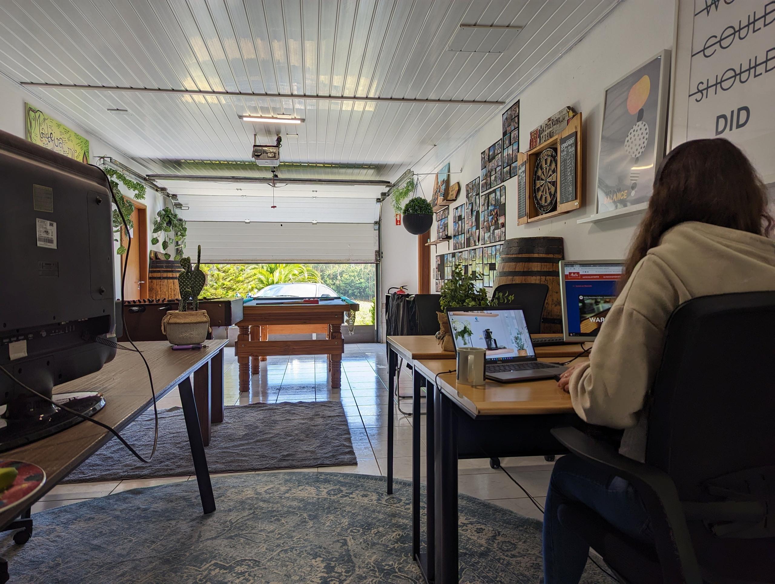 The shared workspace at Homeoffice Madeira with Alena working, providing an inviting environment for remote workers