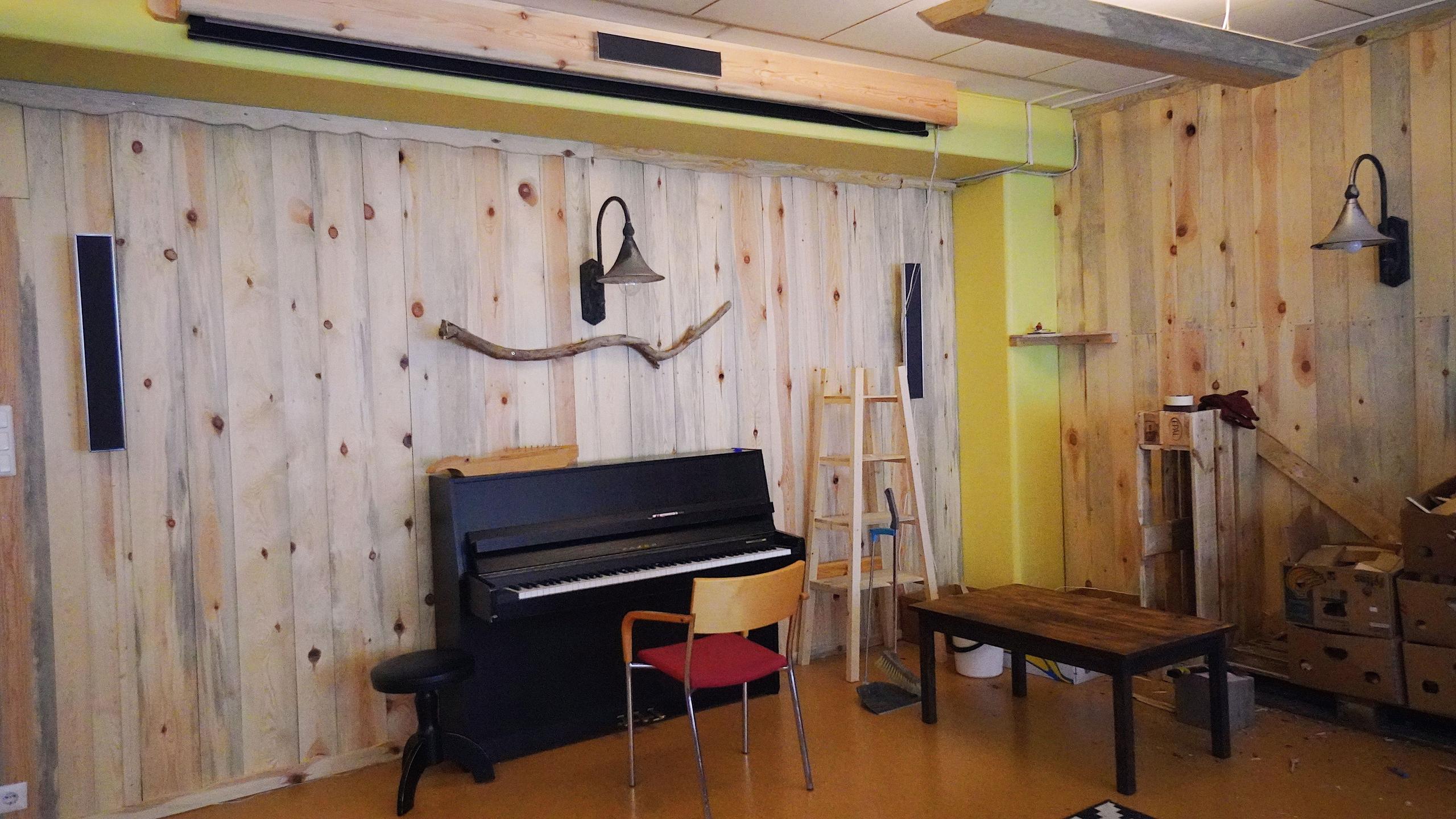 Home cinema and piano area at Hub Feenix