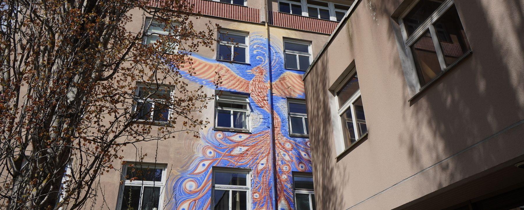 Hub Feenix building exterior with a large phoenix mural painted on the facade