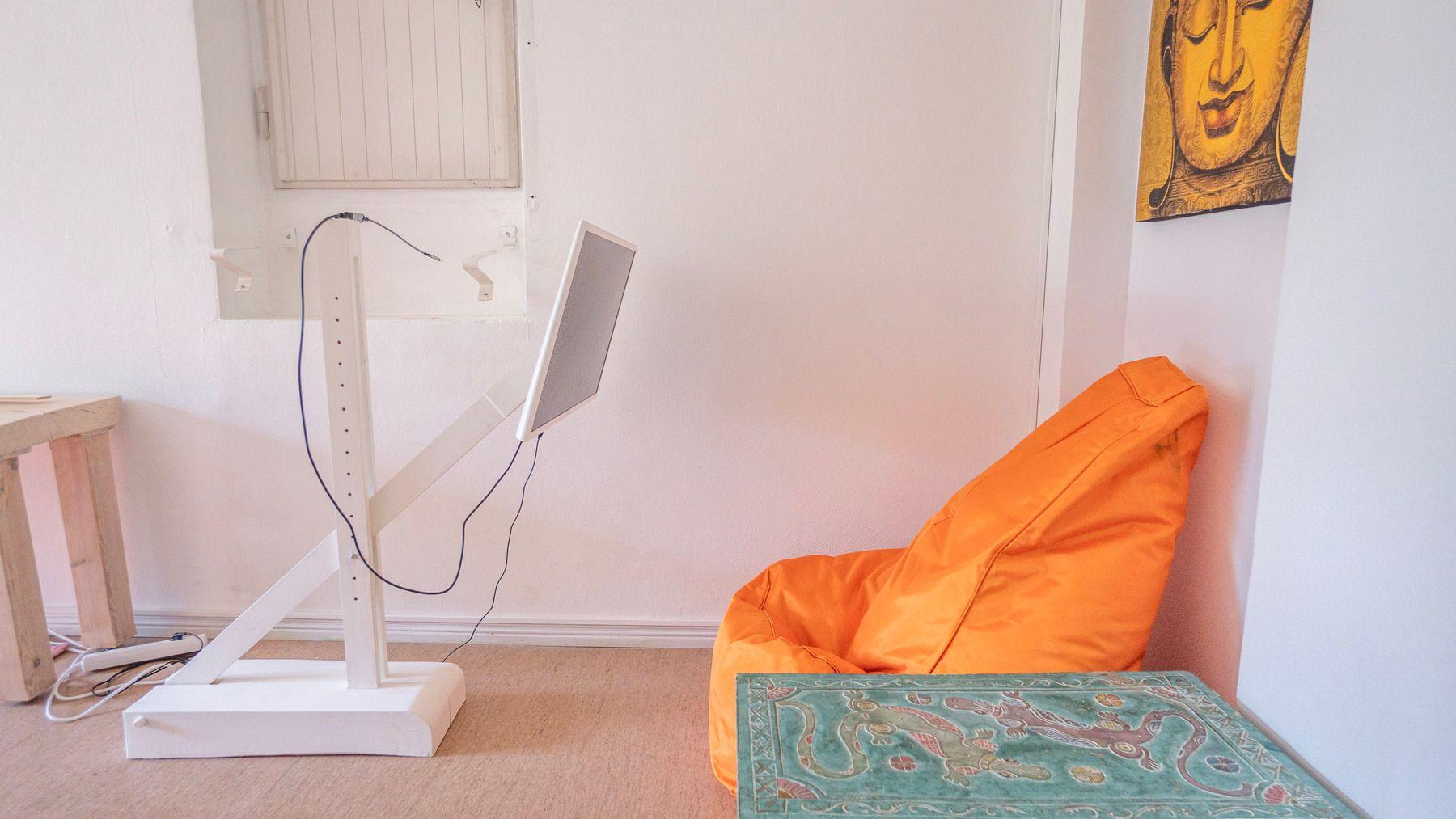 Bean bag seating and display monitor in coworking area