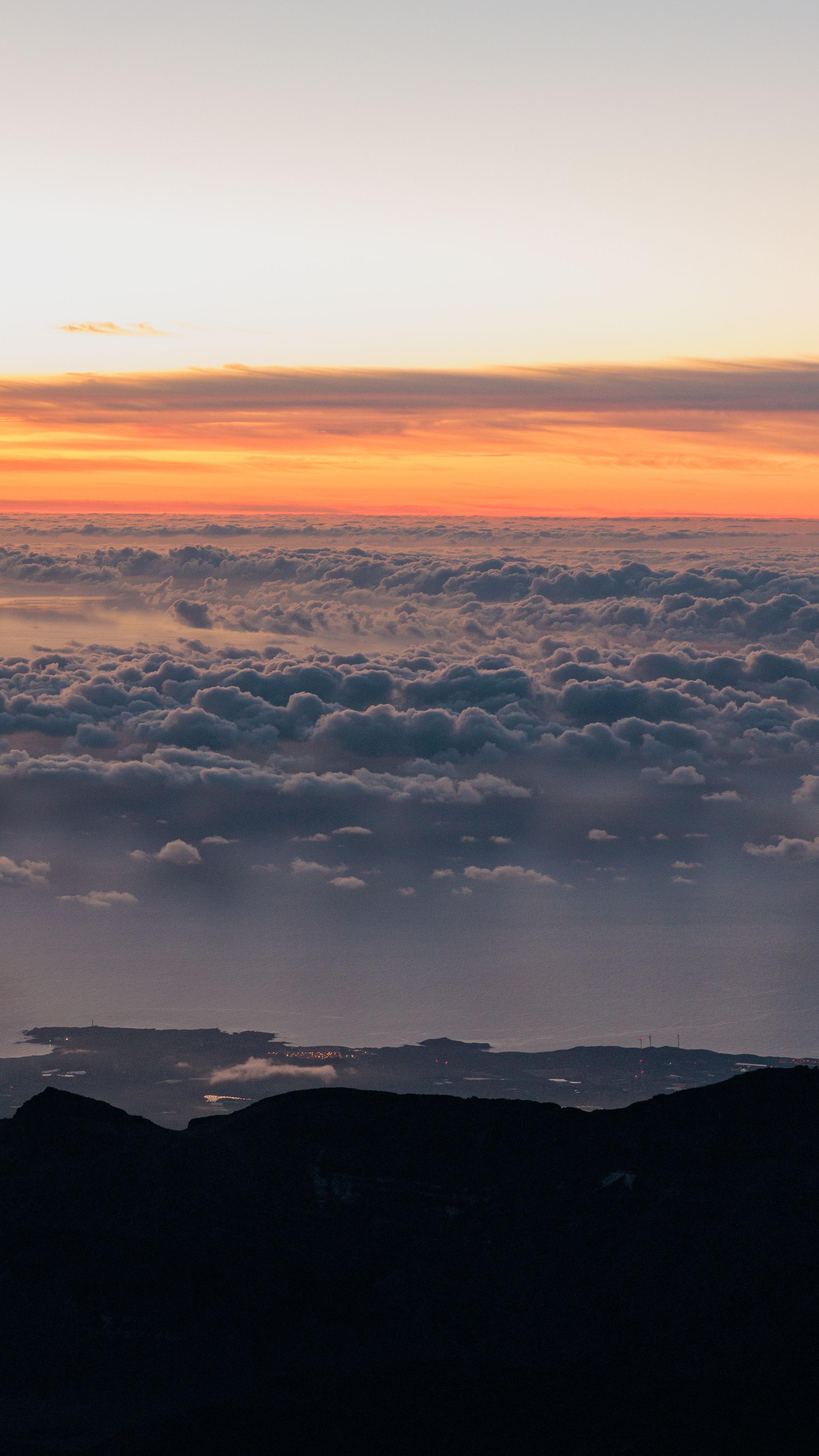 Stunning sunrise view above a sea of clouds from the Teide summit