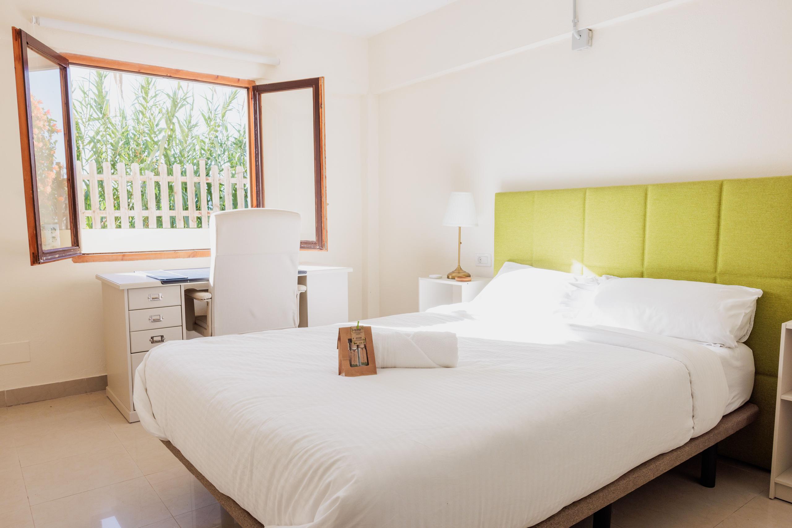 Bright coliving room with desk at Ikigai Coliving Tenerife