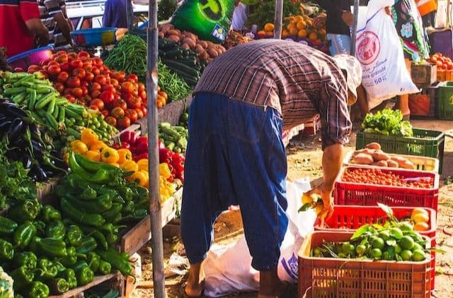 Colorful local market (souk) in Tamraght with fresh vegetables and produce