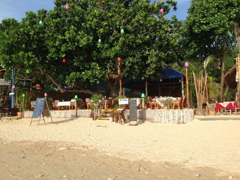 Beachfront restaurant with colorful decorations on Koh Lanta beach