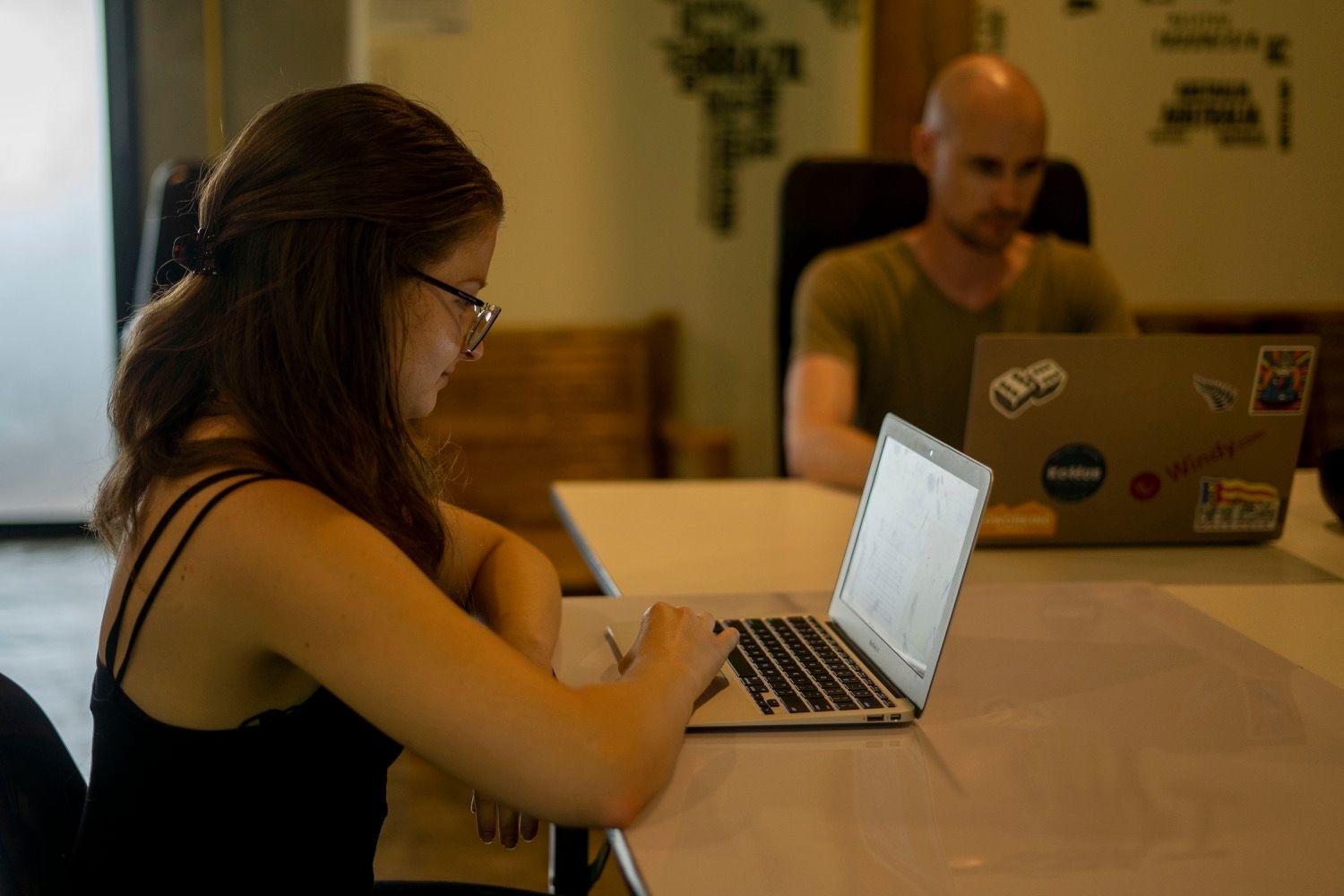 Members working on laptops in a quiet focus A/C room