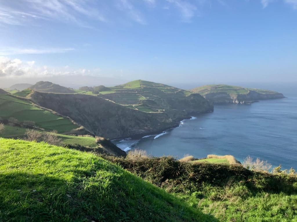 Scenic coastal view of São Miguel, Azores with green hills and ocean