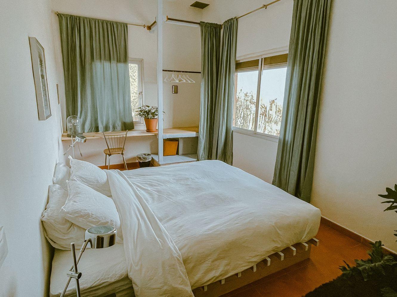 Ocean view double room with a touch of bold 80's design. Think: bright colors, bold shapes, funky furniture and squiggly lines.