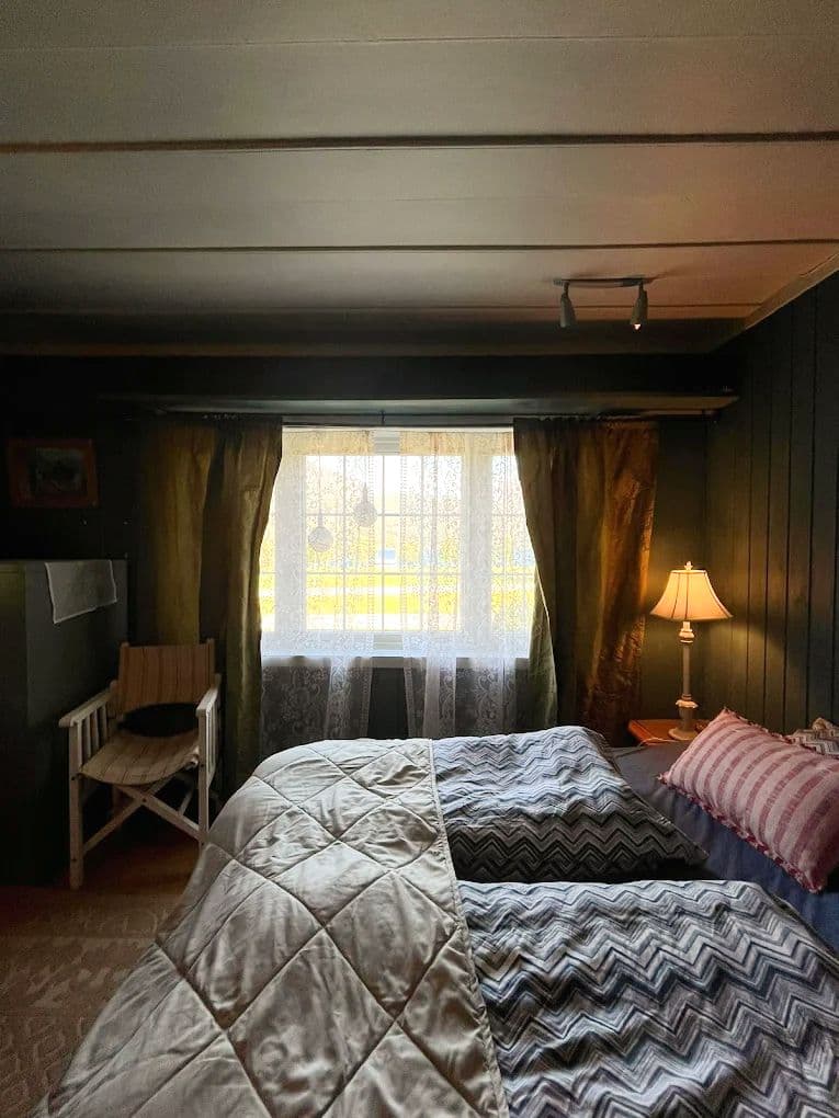 Keipen first floor room with twin bed, looking directly at the pyramid mountain Keipen and the lake