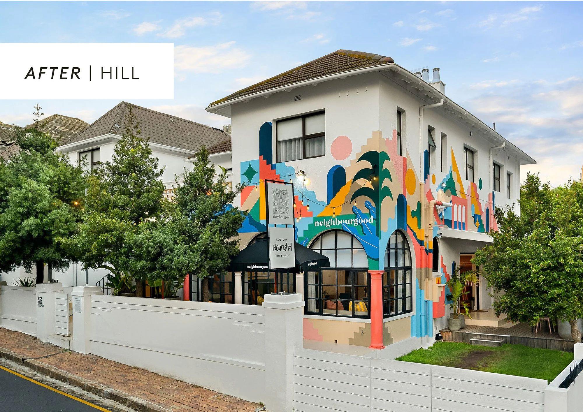 Exterior view of Neighbourgood Hill after renovation, showing the colourful mural facade with 'After | Hill' label
