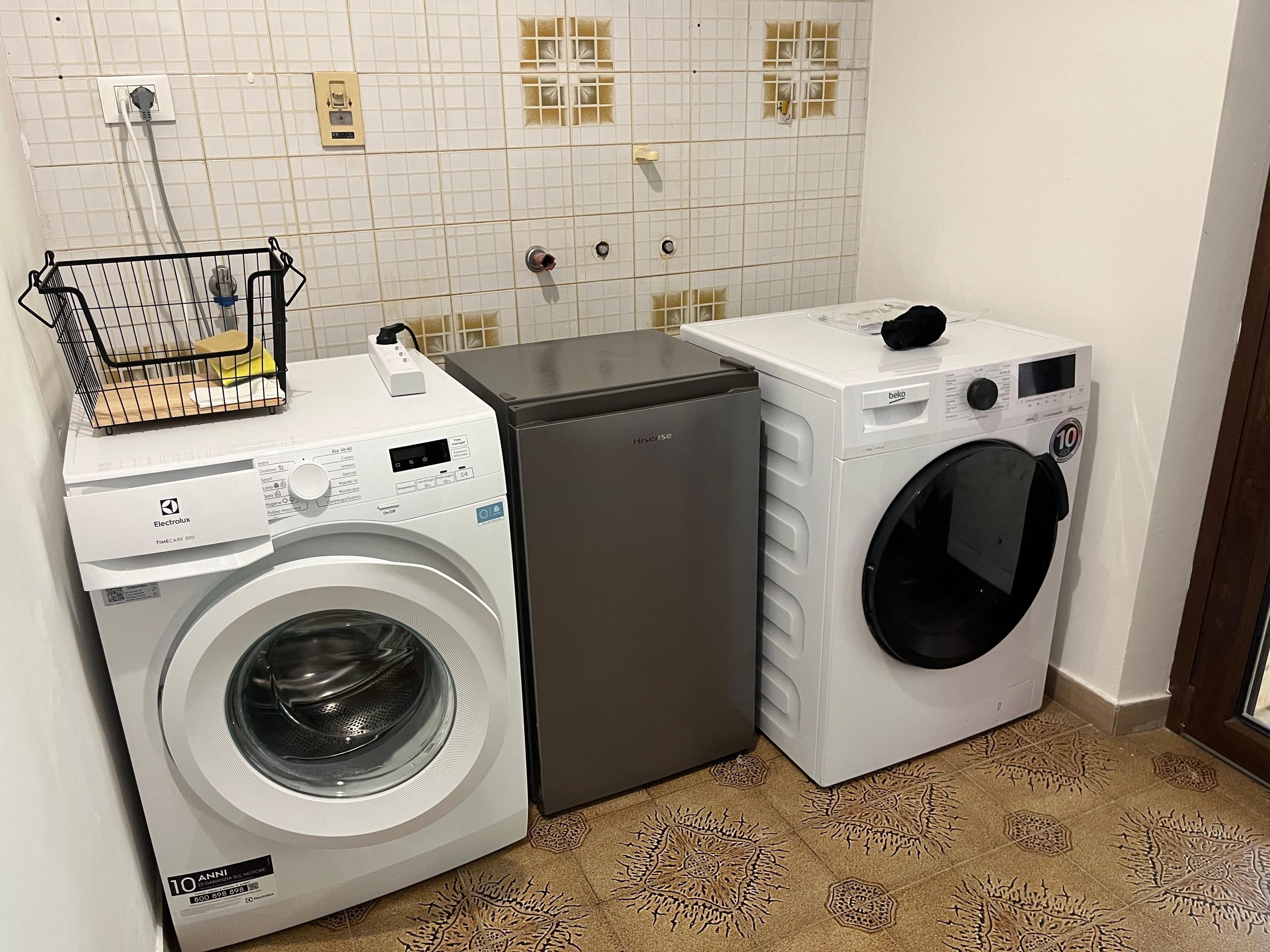 Shared laundry room inside a coliving in Italy near Rome