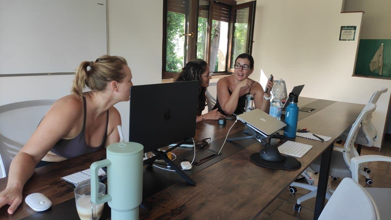 Professional coworking area at coliving Italy with ergonomic desks and high-speed WiFi for focused work