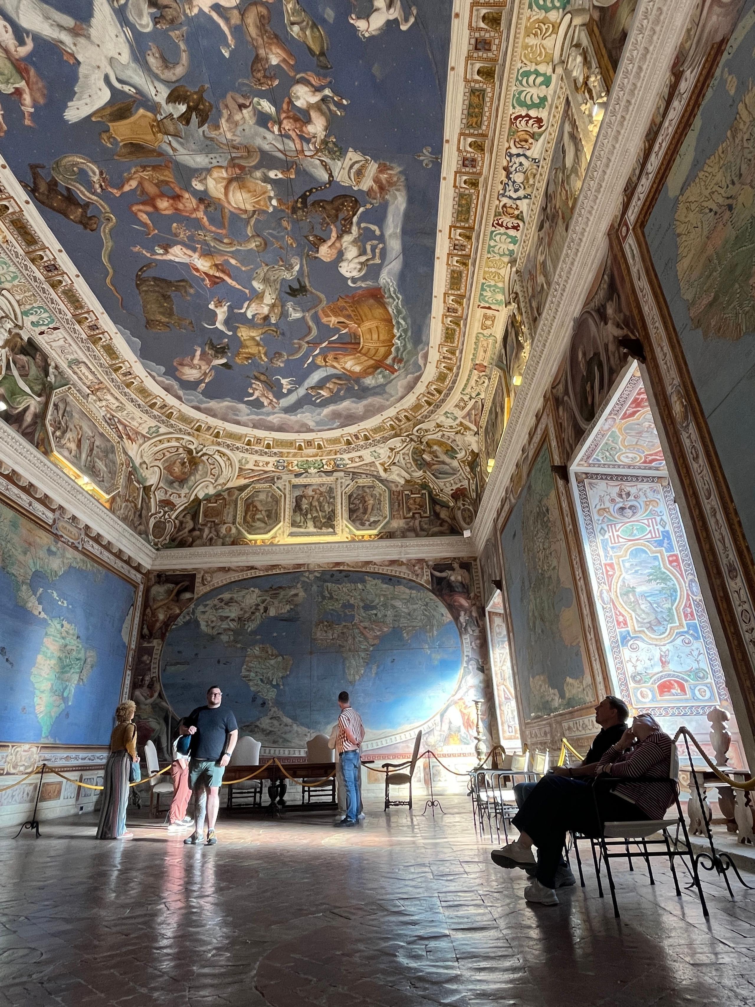 Guests visiting the ornate interior of Palazzo Farnese during a stay at a coliving in Italy near Rome