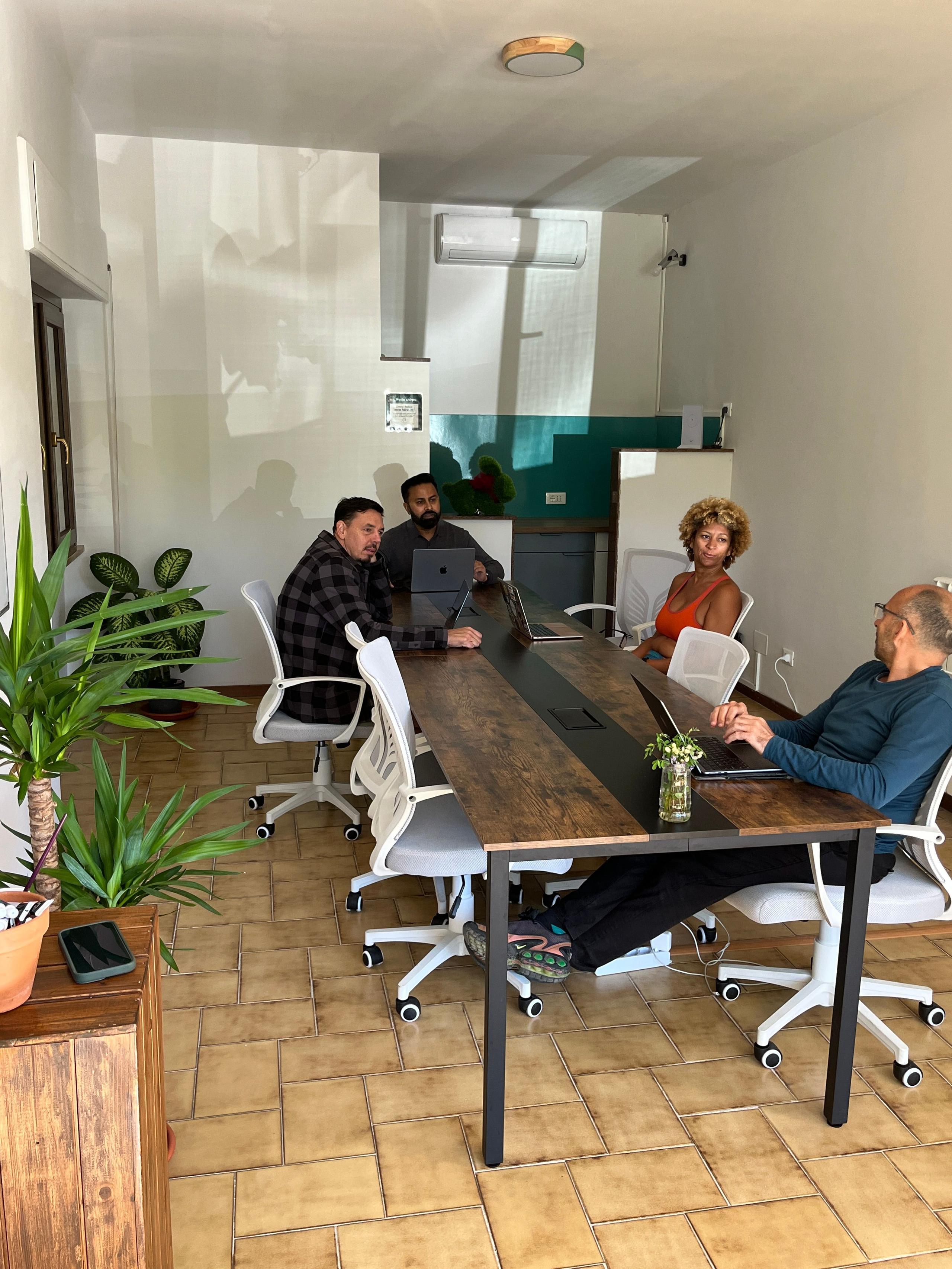 People working in the coworking space at a coliving in Italy near Rome