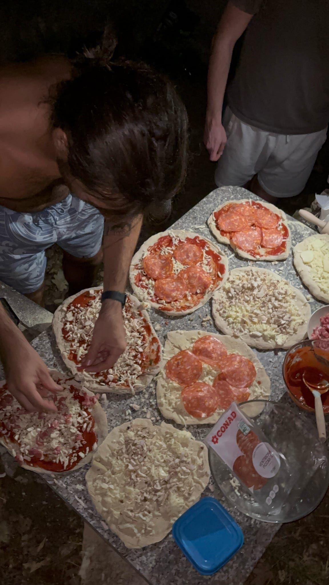 Guests making pizzas together at a coliving in Italy near Rome